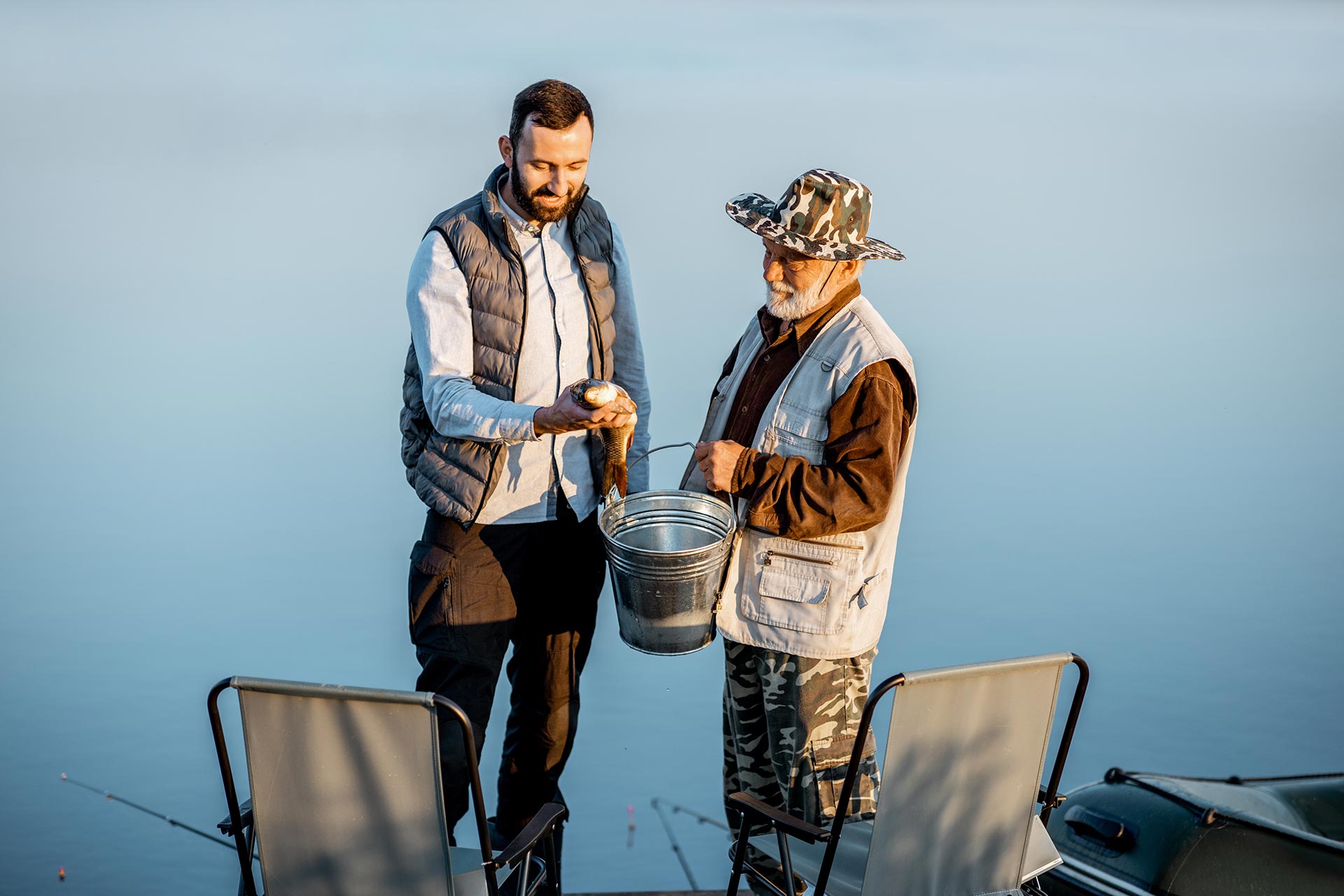 granfother with son fishing on the lake 2023 11 27 05 26 57 utc
